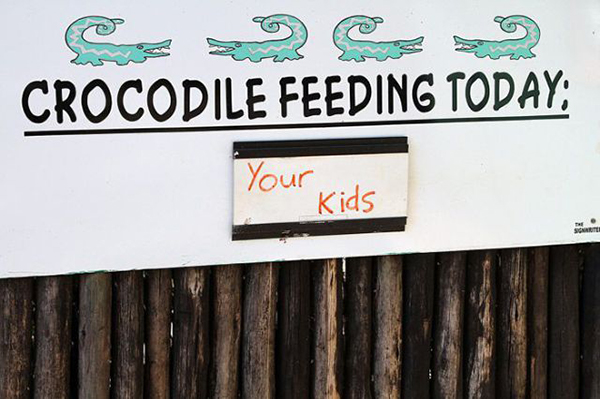 Bizarre-signs-crocodile-feeding-time-your-kids
