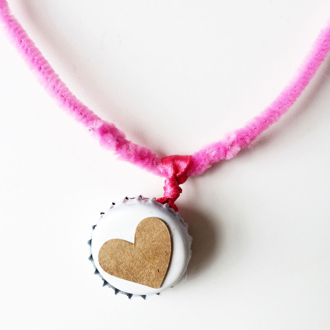 Adorable DIY kids Valentine's bottle cap locket. Hosting a Valentine's Playdate? Click through for fun DIY kids crafts and Valentine's snacks!