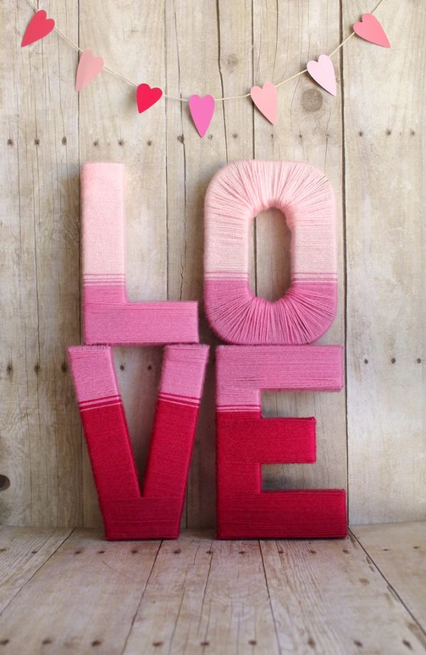 Yarn letters! Click through for 35 amazing, over-the-top Valentine's Day ideas, including Valentine's crafts, Valentine's recipes, and Valentine's decorations, and more!