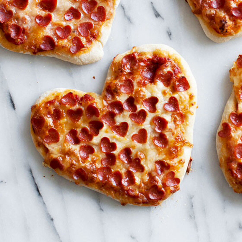 Heart pizza! Click through for 35 amazing, over-the-top Valentine's Day ideas, including Valentine's crafts, Valentine's recipes, and Valentine's decorations, and more!